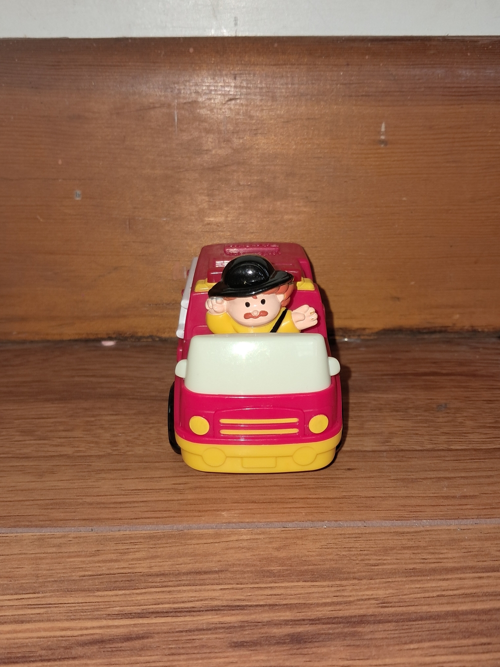 2005 Fisher-Price Little People fire truck which was released as a McDonalds Toy